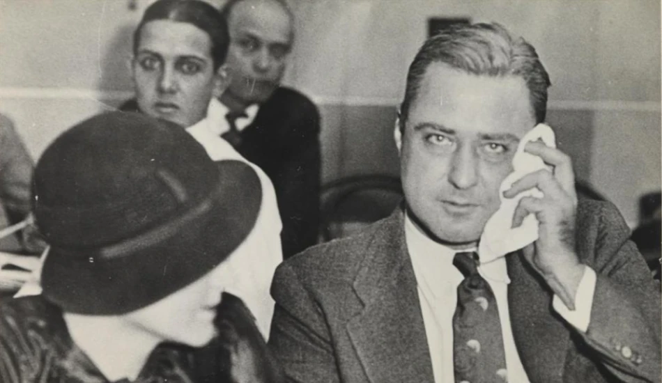 A black and white image of George "Machine Gun" Kelly.